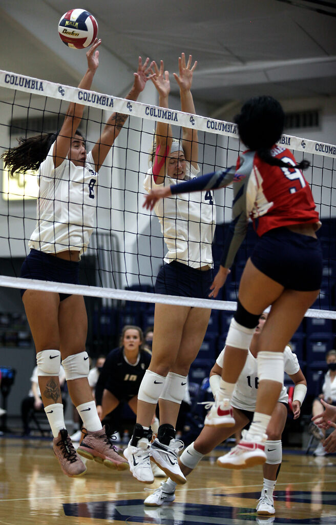 Columbia College sophomore Luisa Ferreira and freshman Ellie Crede attempt a block